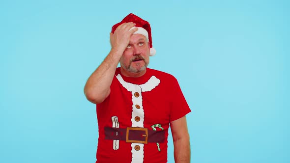Upset Man in Christmas Red Tshirt Making Face Palm Gesture Feeling Bored Disappointed Bad Result alt