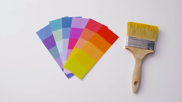 Paint Brush and Color Palette on White Background alt