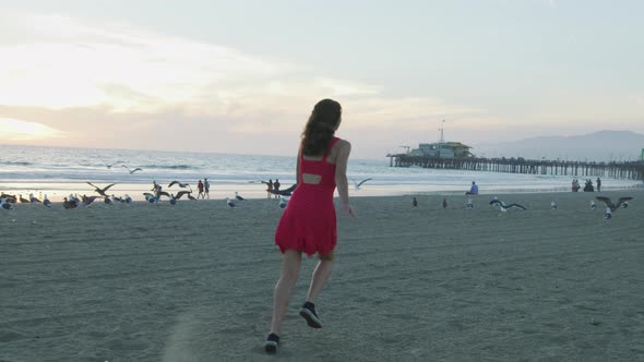 Girl running on Santa Monica beach alt