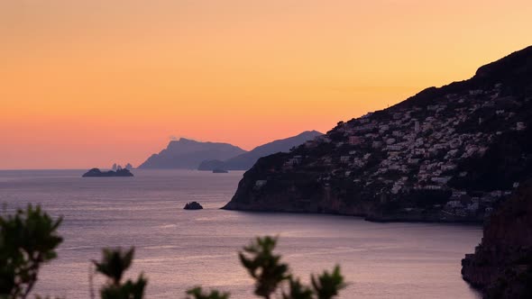 Timelapse video of sunset on the Amalfi Coast with the small town of Praiano on the left. alt