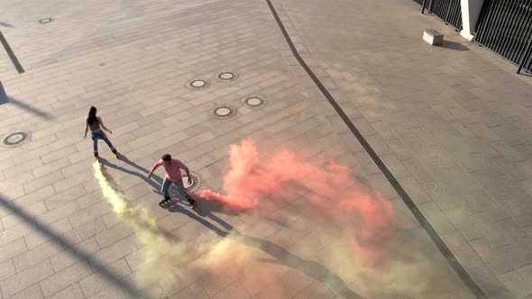 Couple on Rollerblades Outdoors. alt