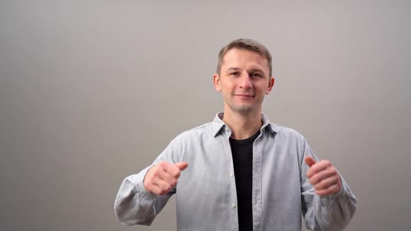 Young Happy European Man Smiling Showing Thumb Up and Isolated on White Background alt