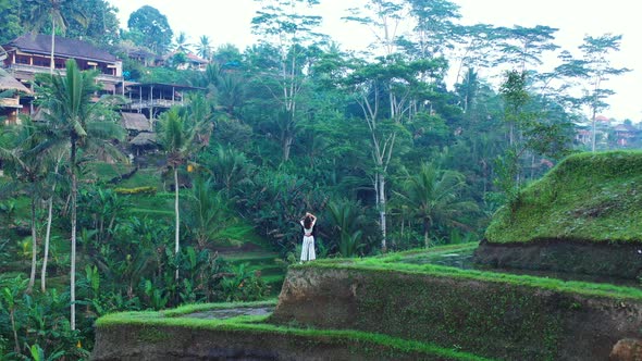 Indonesia Rice Terraces - Couple having a romantic moment in the lush green rice terraces. - Running alt
