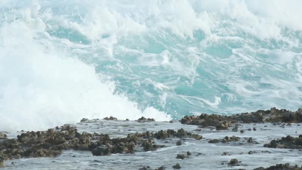 Rocky cliffs near stormy sea alt