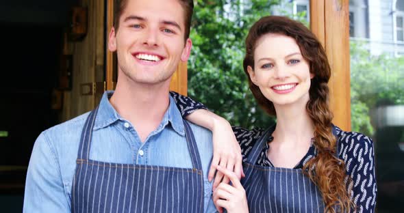 Waiter and waitresses standing at the entrance of cafe alt