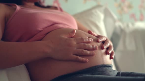 Happy Pregnant Woman and Expecting Baby at Home alt