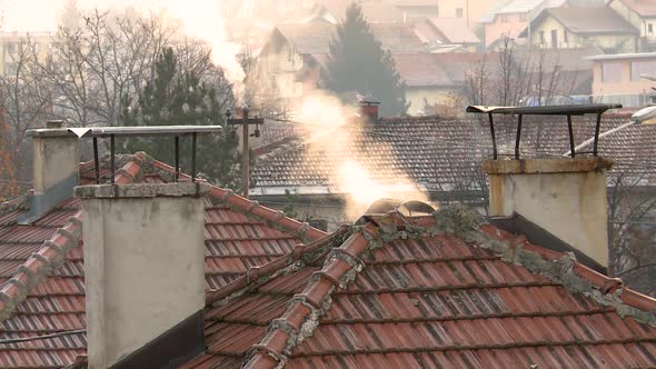 old houses emit smoke in the morning alt