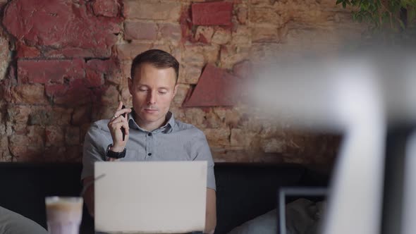 Thoughtful Serious Young Man Student Writer Sit at Home Office Desk with Laptop Thinking of alt