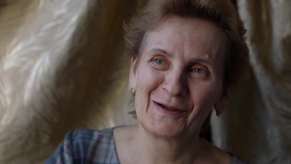 Charming Old Lady is Looking at Camera Calmly Pretty Face with Wrinkles Old Age alt
