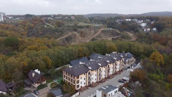 Drone Flying Over the Apartment Building and Forest 4 alt