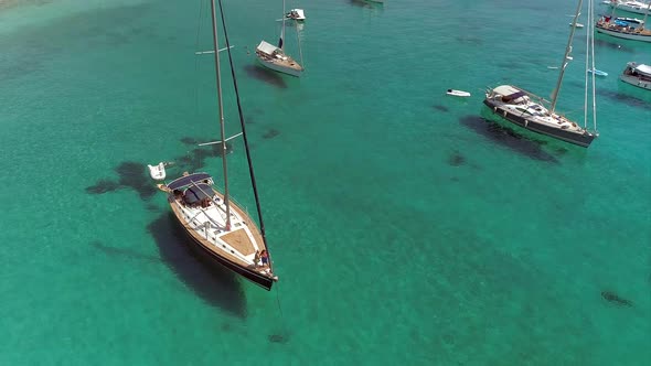 Aerial view circulating sailboat anchored in the mediterranean sea, Greece. alt