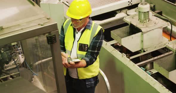 Engineer writing on clipboard alt