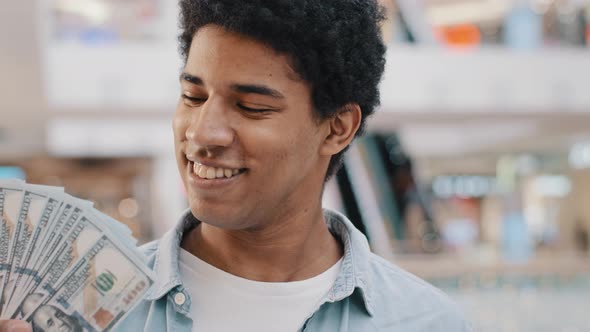 Motivated Happy Inspired African American Guy Bank Customer Rich Man Holding Fan of Dollars alt
