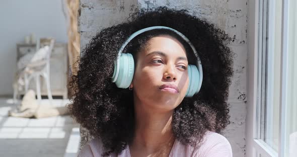 A Gorgeous Mixedrace Woman is Captivated By the Pleasant Sensations alt