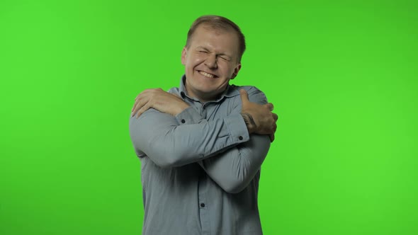 Come Into My Arms, Join Me. Man Smiling Kind and Stretching Hands To Camera, Going To Embrace, Hug alt