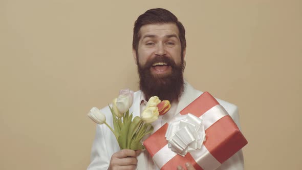 Happy Man with Bouquet of Tulips for Holiday Celebration alt