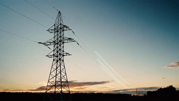 A timelapse of a power line against a sunset summer sky.