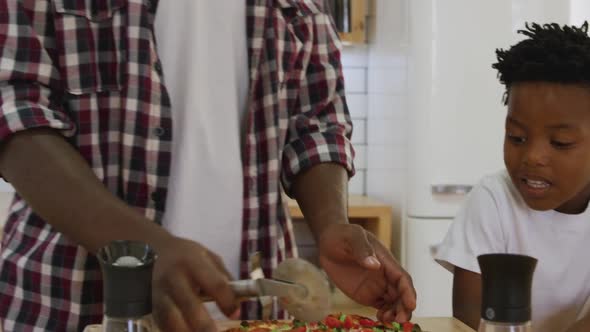 Father and son cooking together alt
