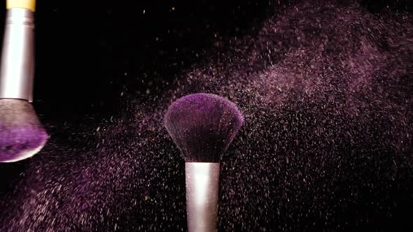 Make Up Brush with Colored Powder at Black Background Slow Motion Concept alt
