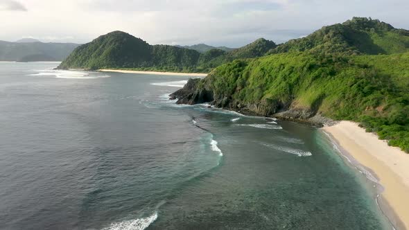 Gently foamy waves washing on the white sandy beach, Pantai Beach, Semeti , Lombok, Bali, Indonesia, alt