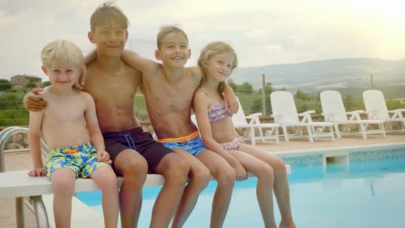 Four Kids Swaying and Having Fun By the Pool Side alt