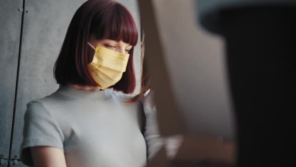 Beautiful Young Smiling Woman with a Child at the Door of Her House and Meets a alt