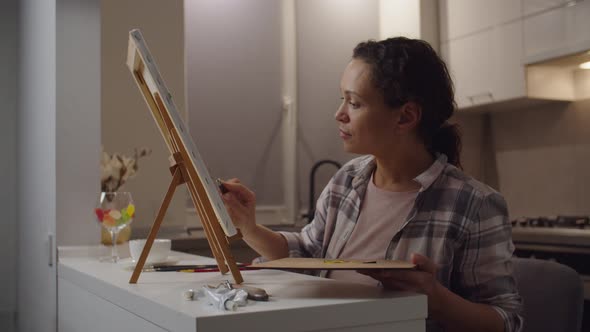 Charming Adult Female is Taken with Painting Indoors alt