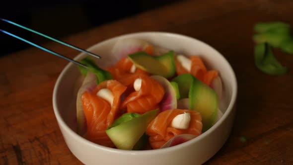 Healthy Salad Bowl with Smoked Salmon. Close-up. Salad Plate. Healthy Eating. Cafe.