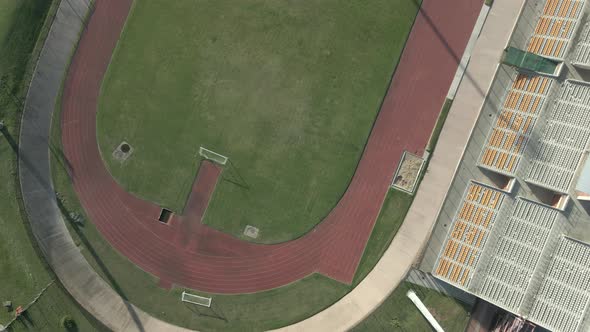 Drone Flying Over Track and Field Stadium