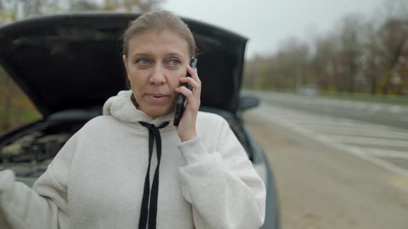 Woman Wtanding At Broken Car Searching For Repair Service alt