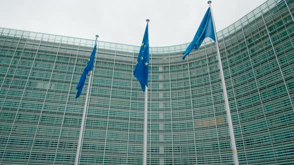 3 Waving EU Flags Near European Commission Office Building in Brussels Belgium