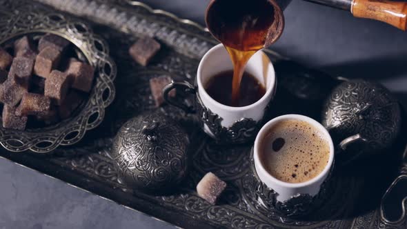 Cezve Pouring Black Coffee Out Oriental Cups in Istanbul alt
