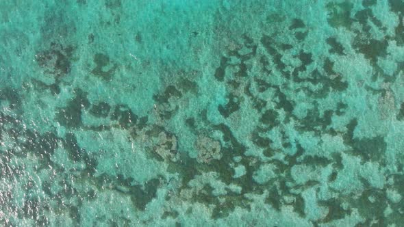 Aerial View of the Beautiful Ocean Floor with Reefs Near Pantai Pandawa alt