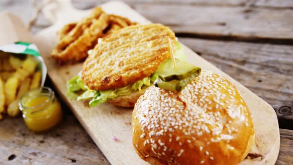 Snacks arranged on wooden table alt