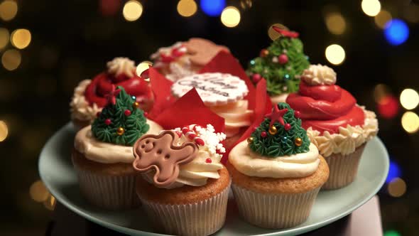 Decorating Cupcakes on Christmas Tree Background