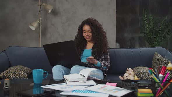 Black Freelance Woman Working on Laptop at Home alt