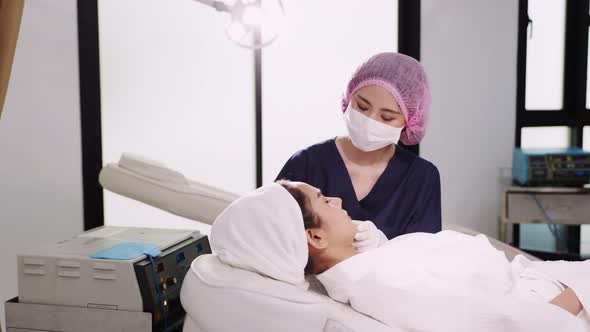 Beauty clinic concept. Young woman getting professional facial procedure.