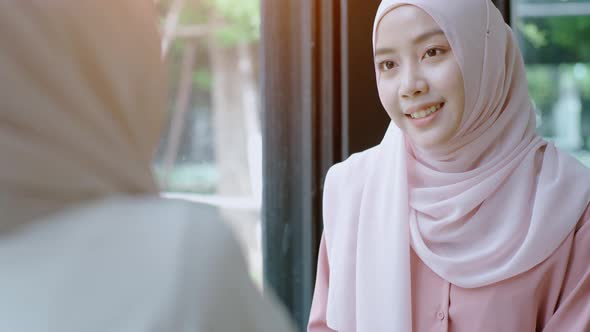 Young Asian Muslim Women Enjoying A Relaxing Moment in the Coffeeshop 08 alt
