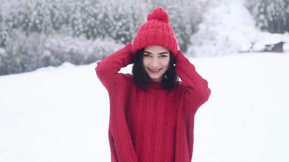 A Beautiful Smiling Girl Posing in Winter alt