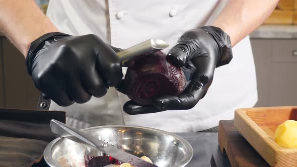 Chef Peeling Boiled Beet Closeup alt