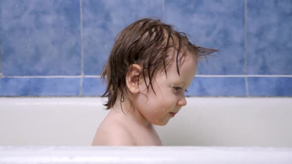 2-3 Year Old Girl Takes a Bath. Wet Hair. Cute Blonde Child. Pretty Little Child Girl