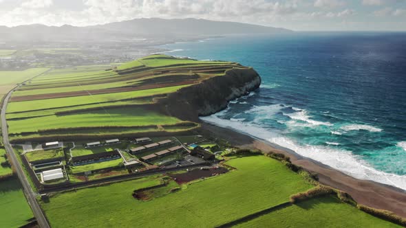 Drone Footage of Neat Grasslands Washed with the Ocean alt