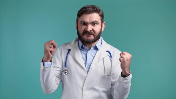 Angry Stressed Doctor Man Shouting Isolated Over Blue Background alt