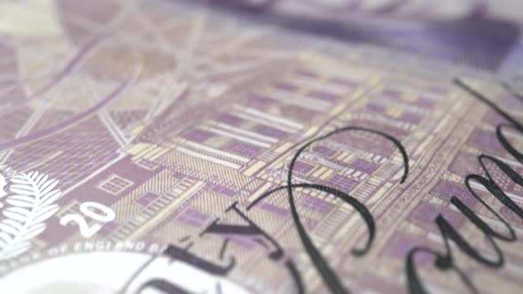 Fifty British Pound paper banknote in close up macro view dolly shot. alt