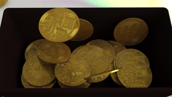 Close-up of bitcoin coins fall into a black box Animation 3D