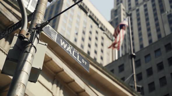 Wall Street Sign with American in Background