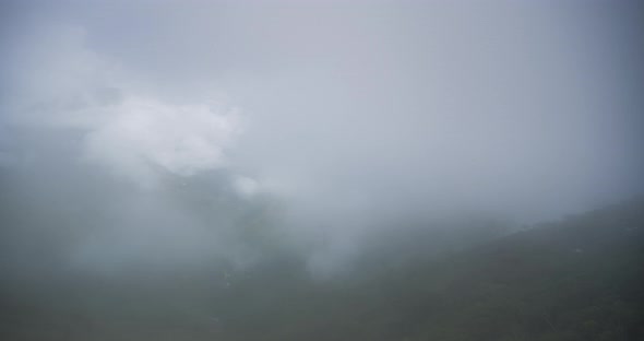 Timelapse in Bolivia Andes Mountains scenery, of clouds clearing and weather moving to reveal valley alt
