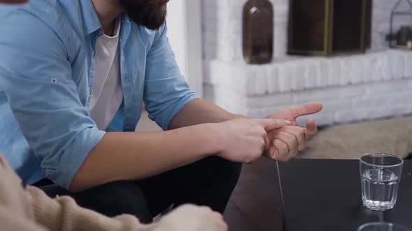 Man Making Calculations on Fingers about Problems with His Disappointing Girlfriend alt