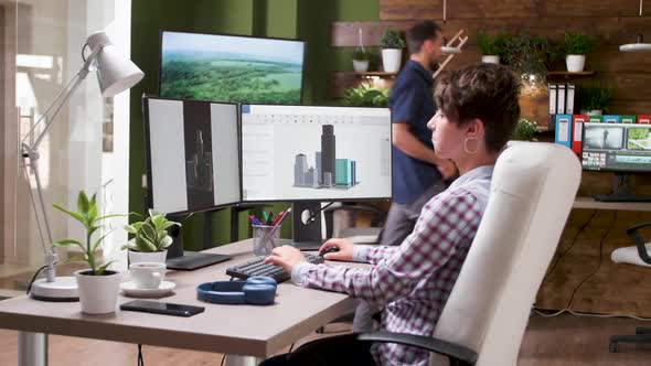 Young Female Architect Working in 3D Software alt