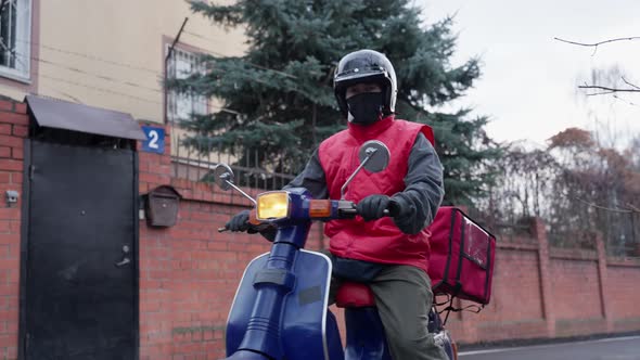 Courier Delivering Parcel Box By Motorcycle or Scooter
